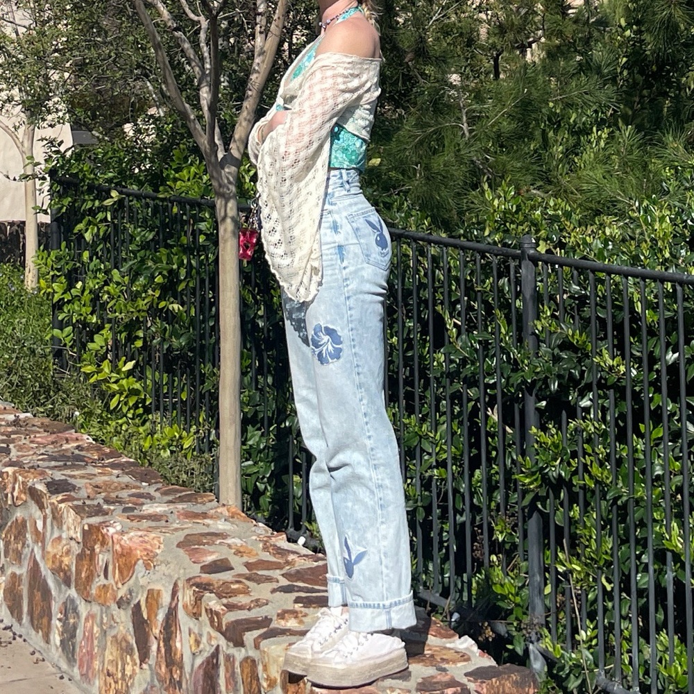 Light wash high waisted flared jeans with patches